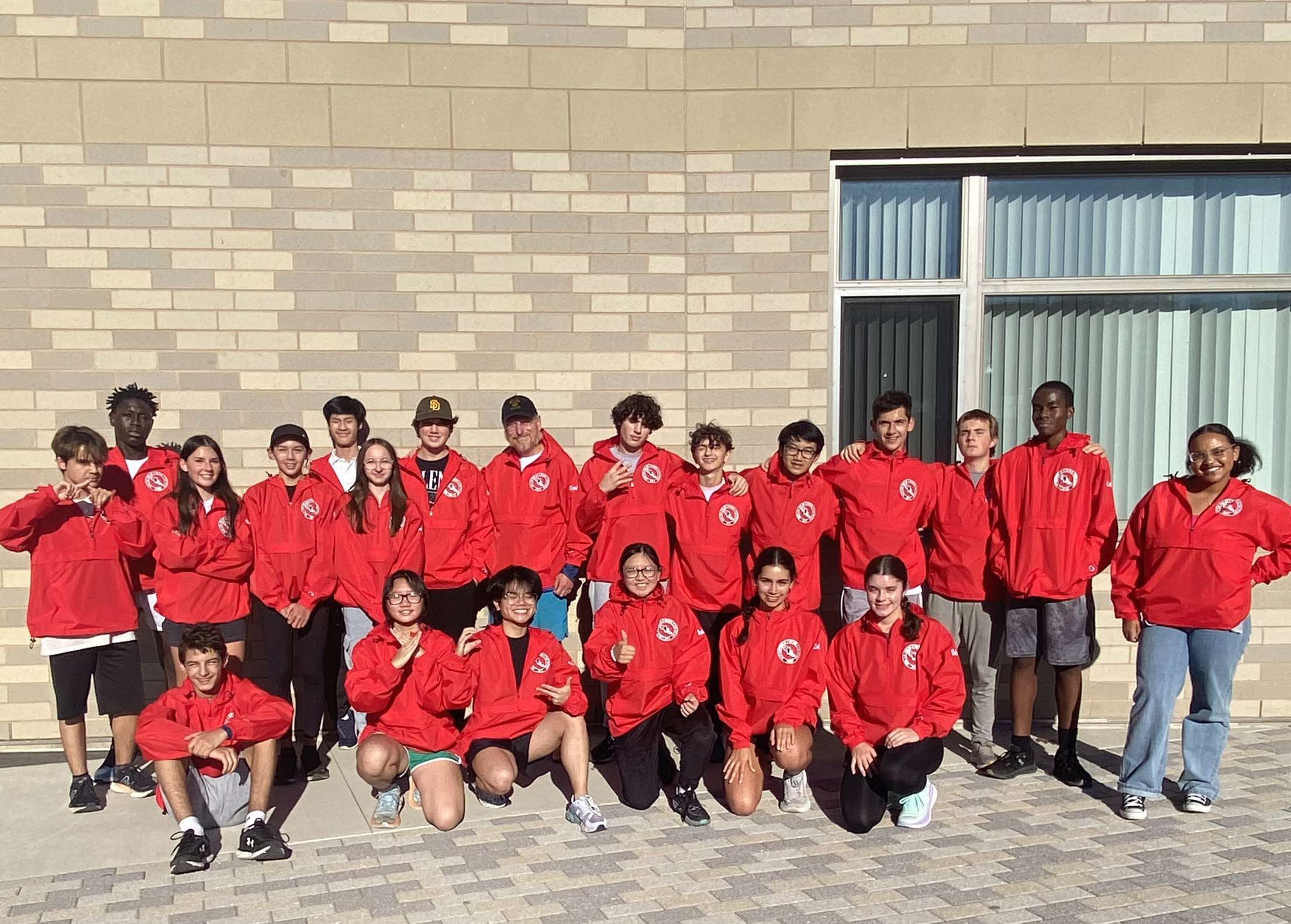 The cross country team in their windbreakers